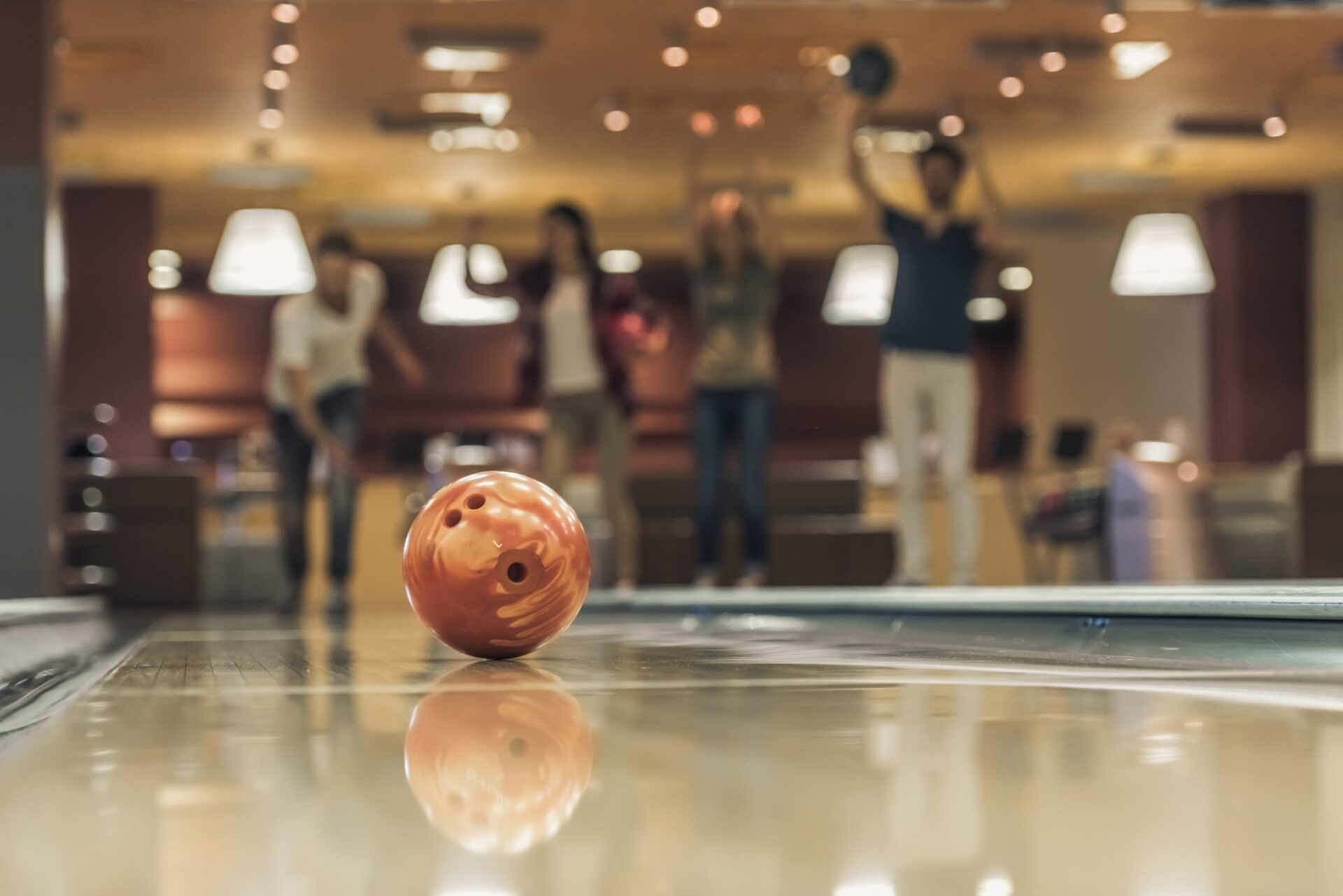 Friends playing bowling