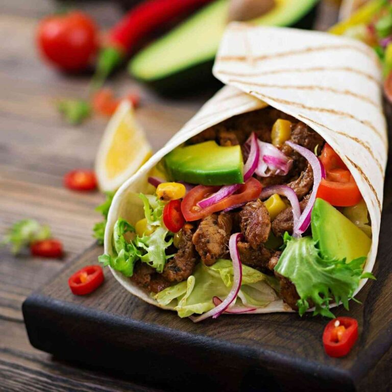 mexican tacos with beef in tomato sauce and avocado salsa.jpg